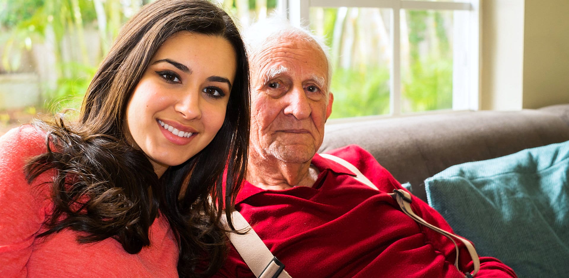 senior man with caregiver at home